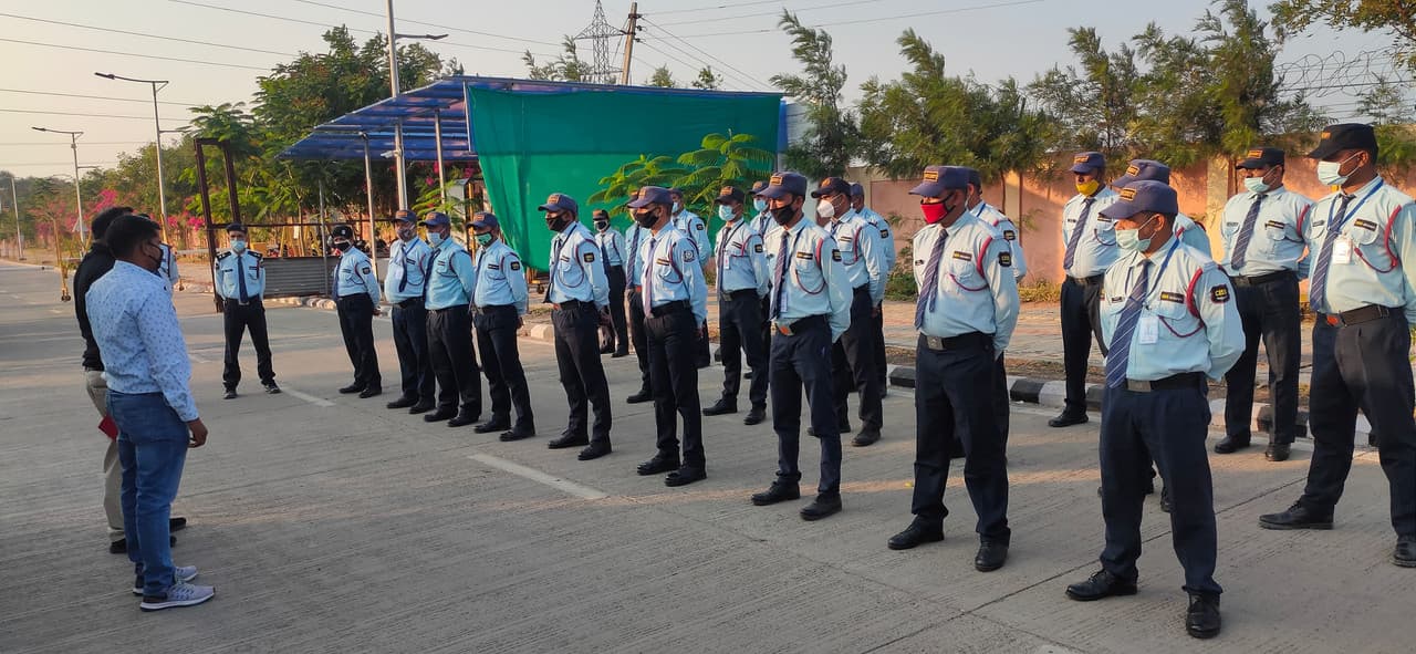 Security guards patrolling a modern facility.